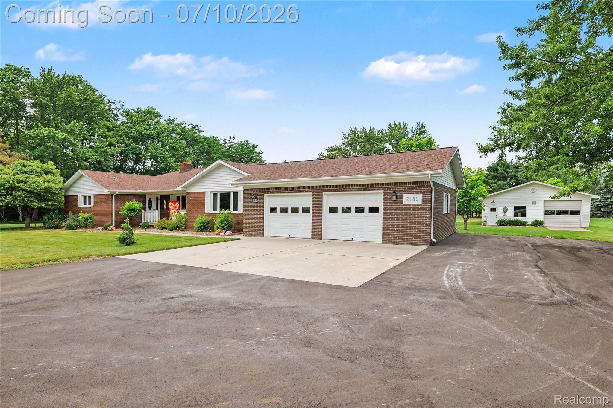 2180 Hurst Road St. Clair, MI 48079 - Photo 2 of 39 Brick ranch-style residence featuring a two-car attached garage and a separate outbuilding with a single garage door