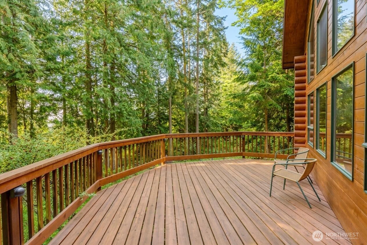 214 Cougar Crest Road Sequim, WA 98382 - Photo 18 of 30 a view of balcony with wooden floor and fence