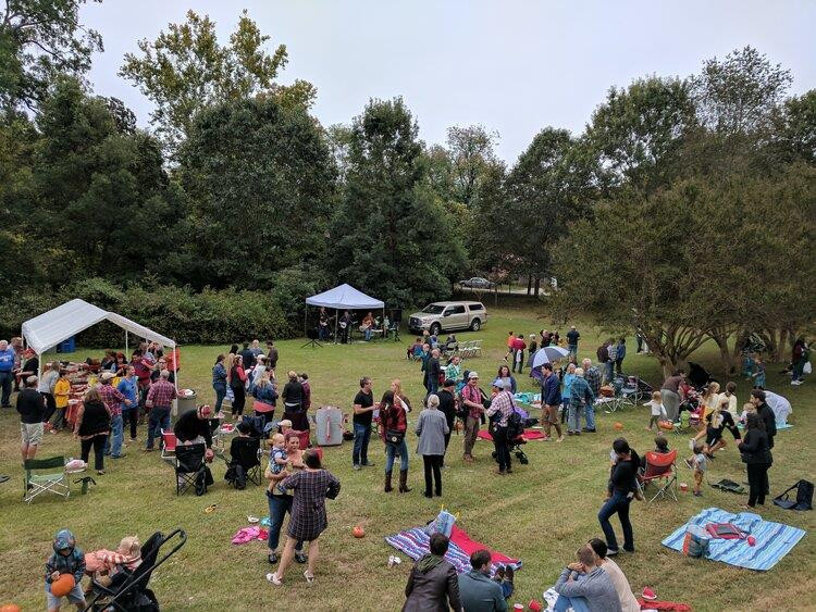 518 East Lane Street Raleigh, NC 27601 - Photo 22 of 29 Oakwood is like an urban village with an annual Candlelight Tour, 4th of July parade and picnic, monthly pot-luck suppers, much more. This is the fall pig pickin at the Cemetery.
