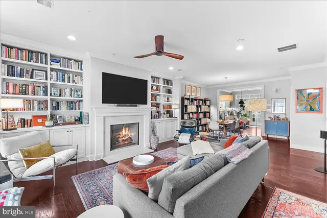a living room with furniture fireplace and a flat screen tv