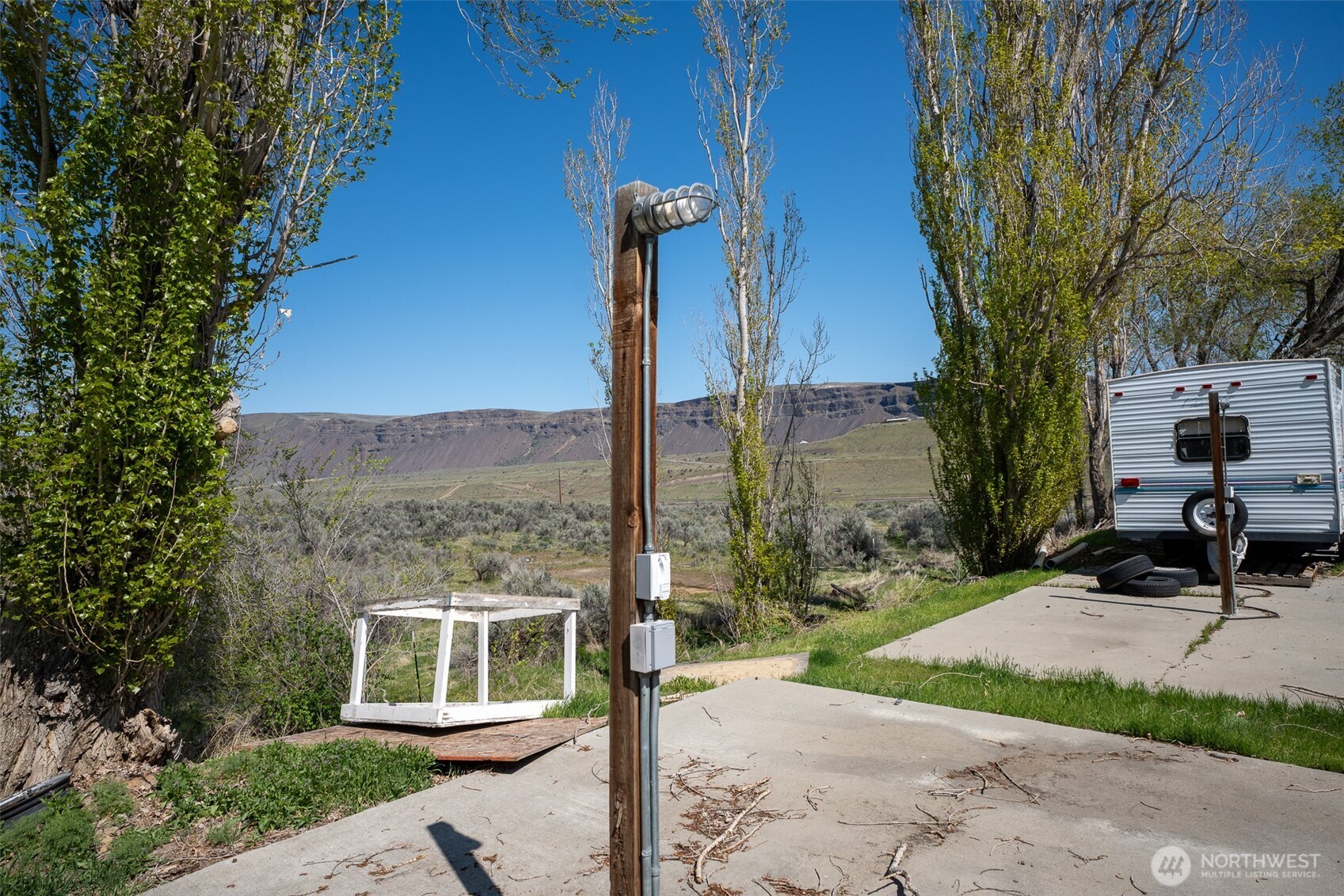 7199 Tarpiscan Road, Unit LOT 2 Malaga, WA 98828 - Photo 8 of 13 a view of a bench in front of a building