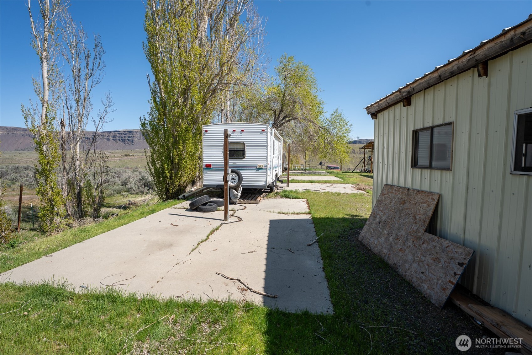 7199 Tarpiscan Road, Unit LOT 2 Malaga, WA 98828 - Photo 9 of 13 a view of a patio with a chairs in patio