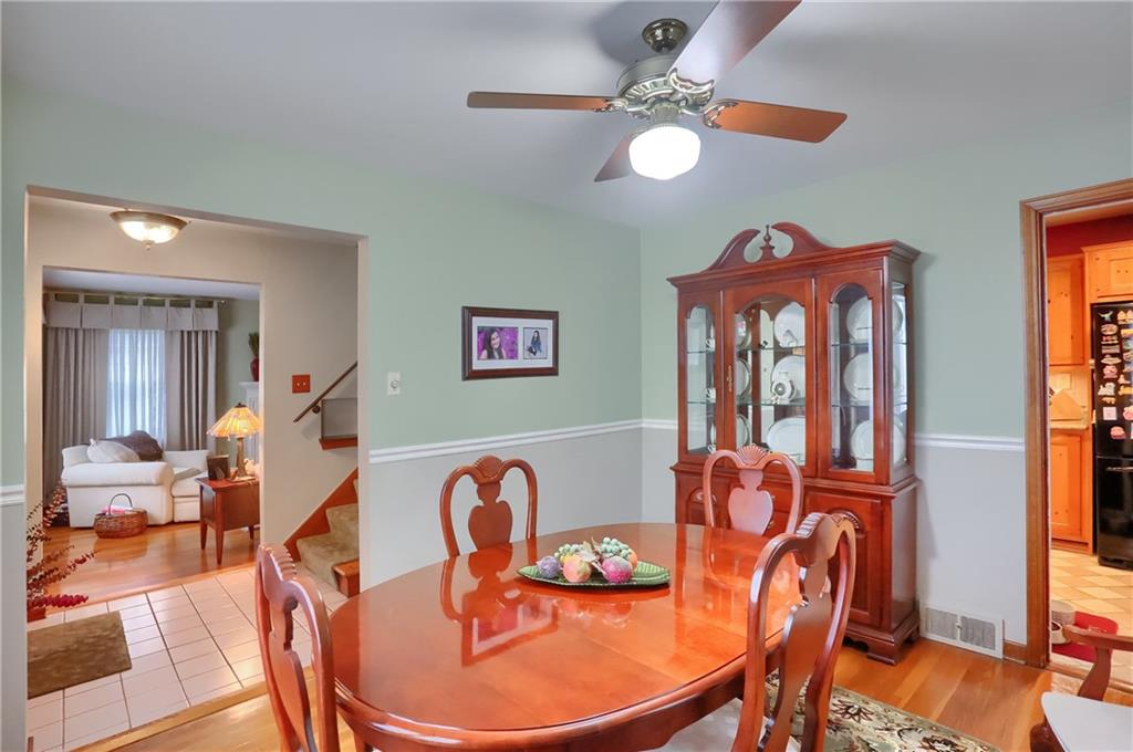 19 Marquette Road Pittsburgh, PA 15229 - Photo 11 of 38 a dining room with furniture a chandelier and wooden floor