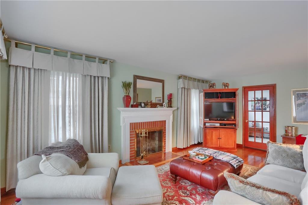 19 Marquette Road Pittsburgh, PA 15229 - Photo 13 of 38 a living room with furniture and a fireplace