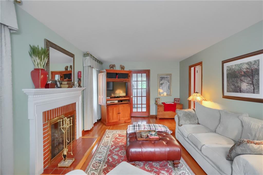 19 Marquette Road Pittsburgh, PA 15229 - Photo 15 of 38 a living room with furniture and a fireplace