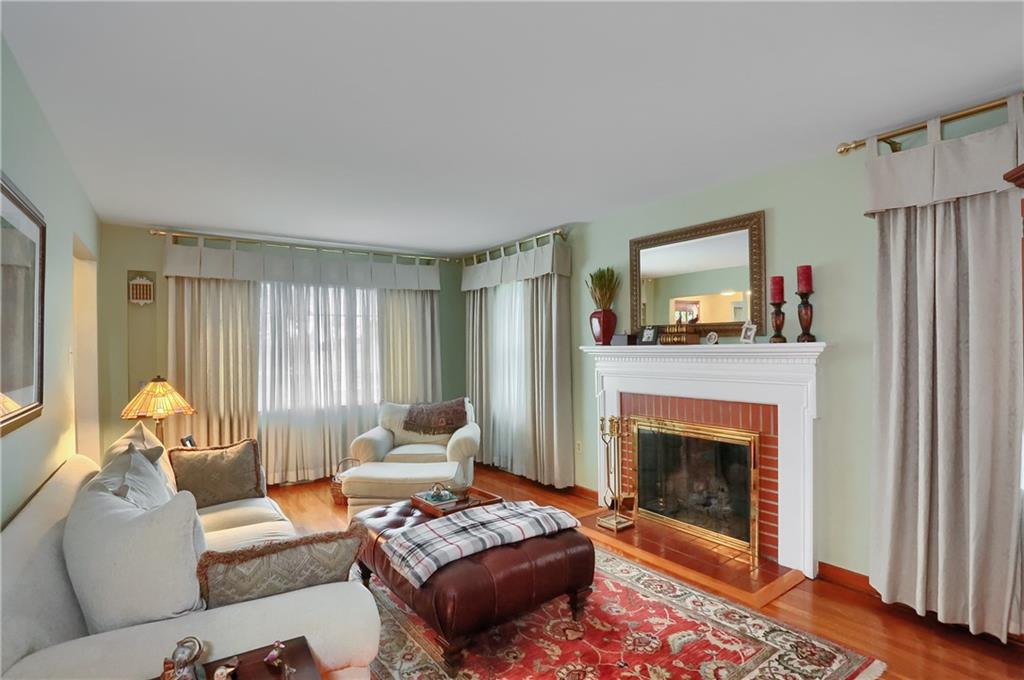 19 Marquette Road Pittsburgh, PA 15229 - Photo 16 of 38 a living room with furniture and a fireplace