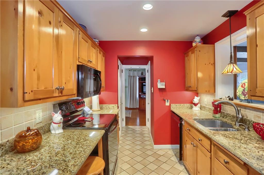 19 Marquette Road Pittsburgh, PA 15229 - Photo 22 of 38 a kitchen with sink a faucet and chairs