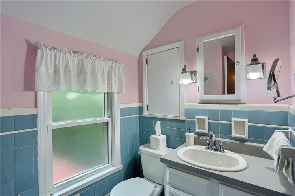 19 Marquette Road Pittsburgh, PA 15229 - Photo 35 of 38 a bathroom with a sink a toilet and mirror