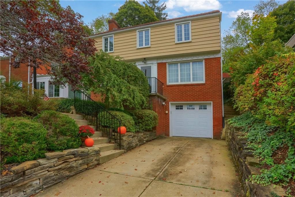 19 Marquette Road Pittsburgh, PA 15229 - Photo 5 of 38 a front view of a house with a yard and garage