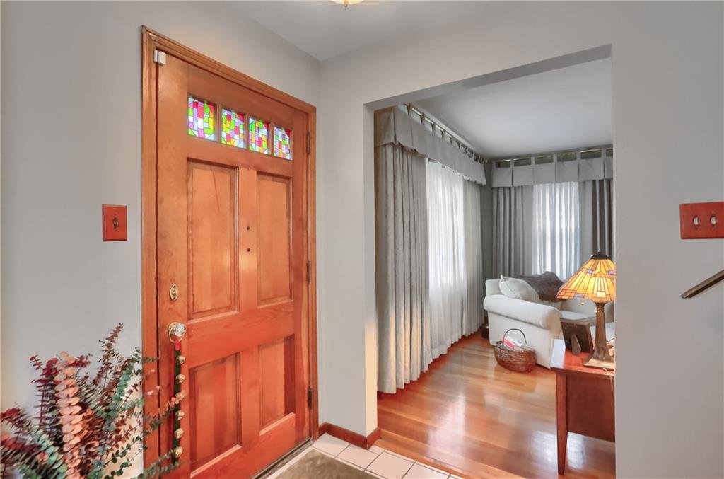 19 Marquette Road Pittsburgh, PA 15229 - Photo 7 of 38 a view of a livingroom with furniture and stairs