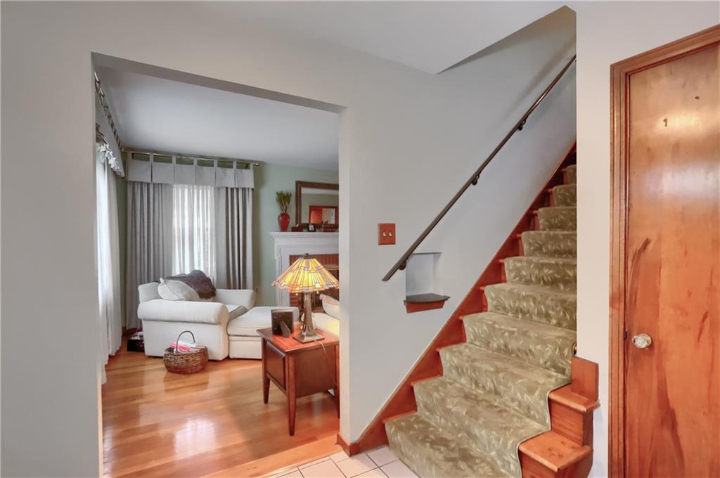 19 Marquette Road Pittsburgh, PA 15229 - Photo 9 of 38 a living room with furniture and stairs