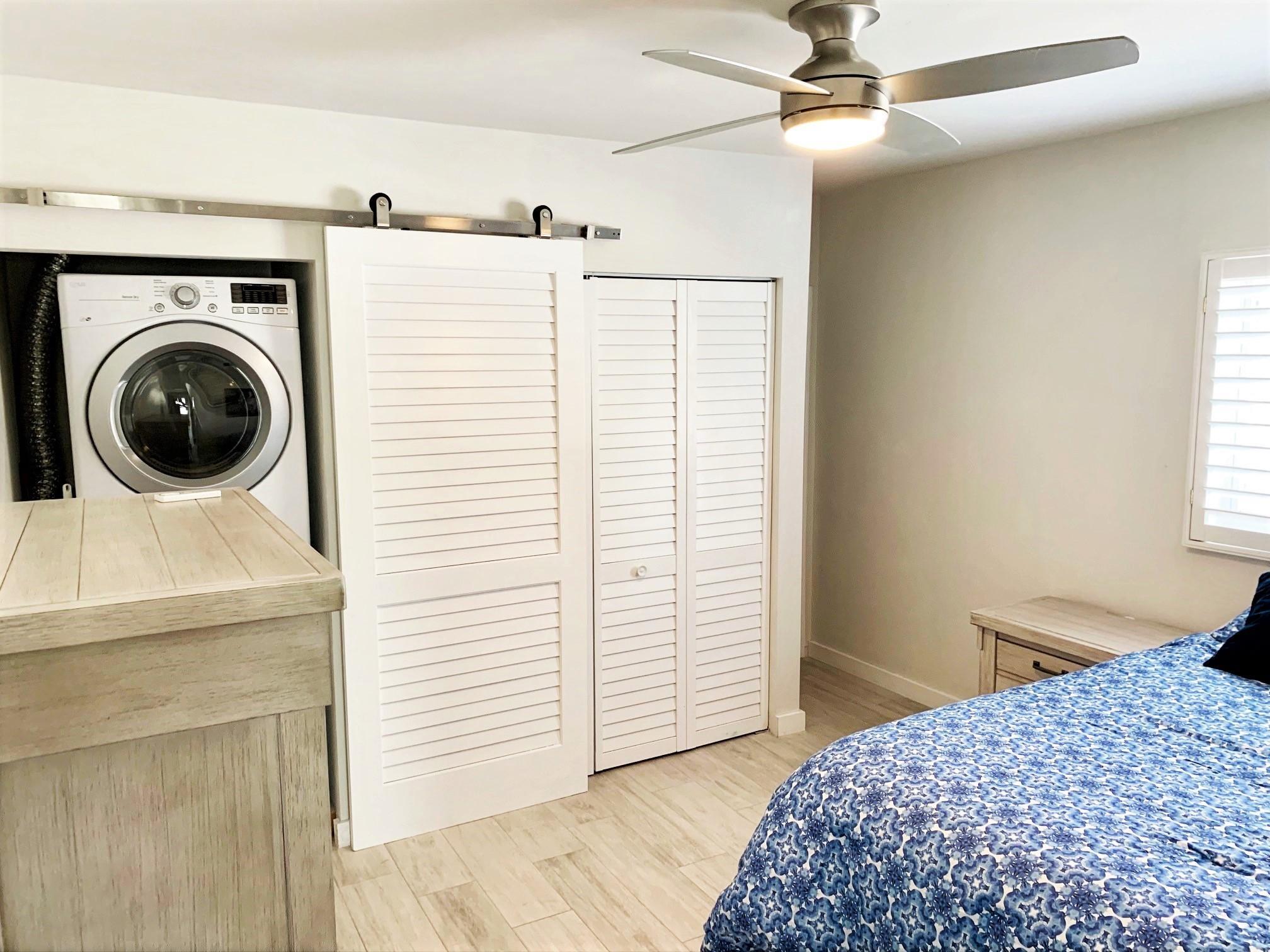 1020 Casuarina Road Delray Beach, FL 33483 - Photo 12 of 17 a bedroom with a bed and a window