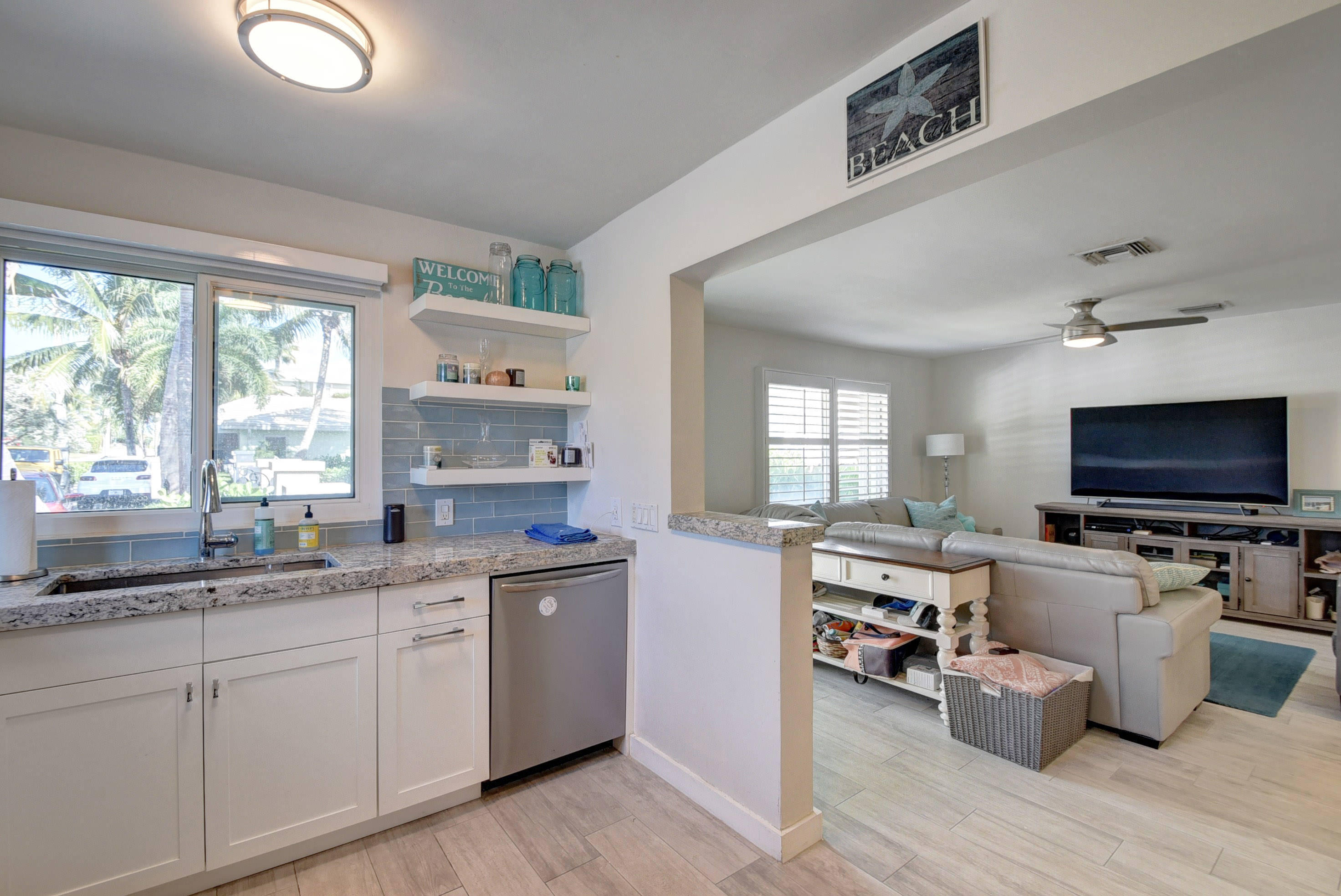 1020 Casuarina Road Delray Beach, FL 33483 - Photo 3 of 17 a living room with furniture and flat screen tv