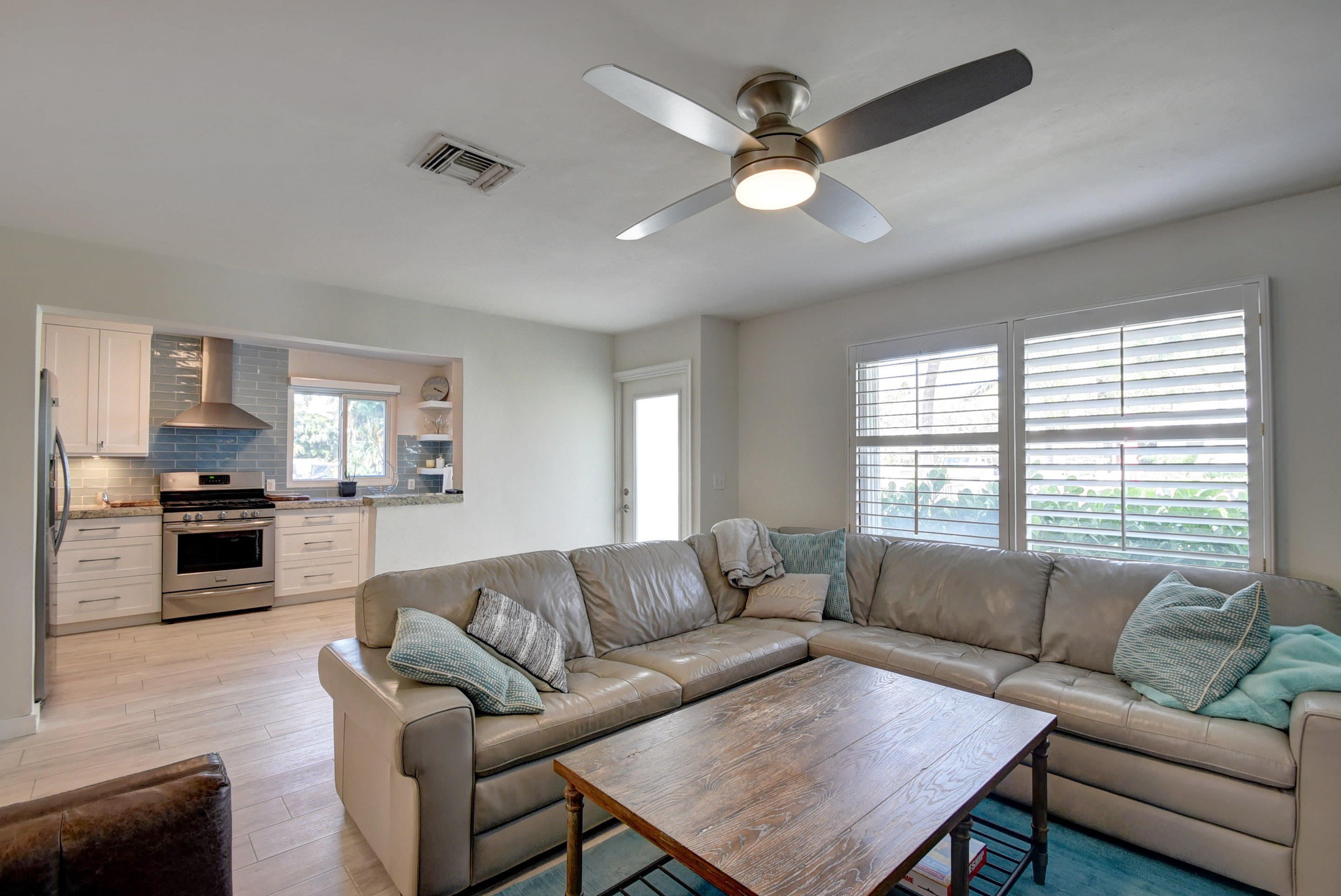 1020 Casuarina Road Delray Beach, FL 33483 - Photo 5 of 17 a living room with furniture and a large window