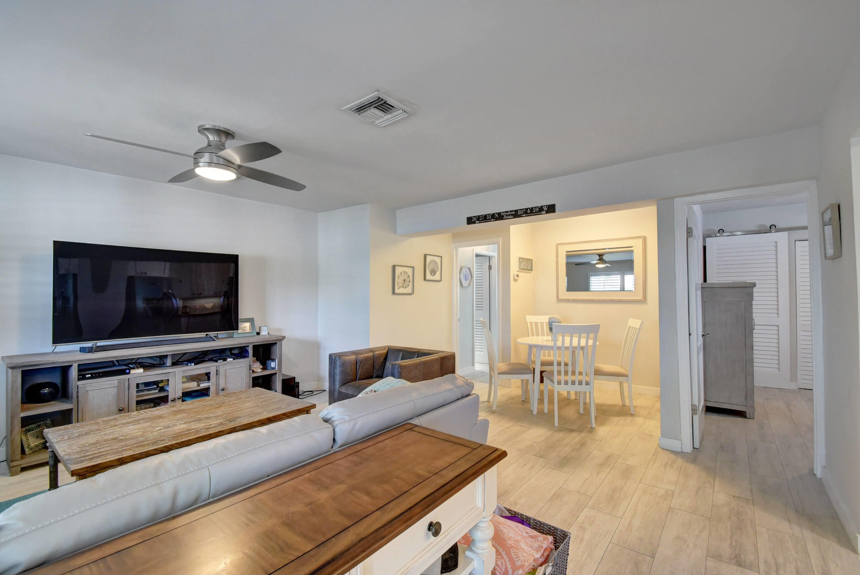 1020 Casuarina Road Delray Beach, FL 33483 - Photo 6 of 17 a living room with furniture and a flat screen tv