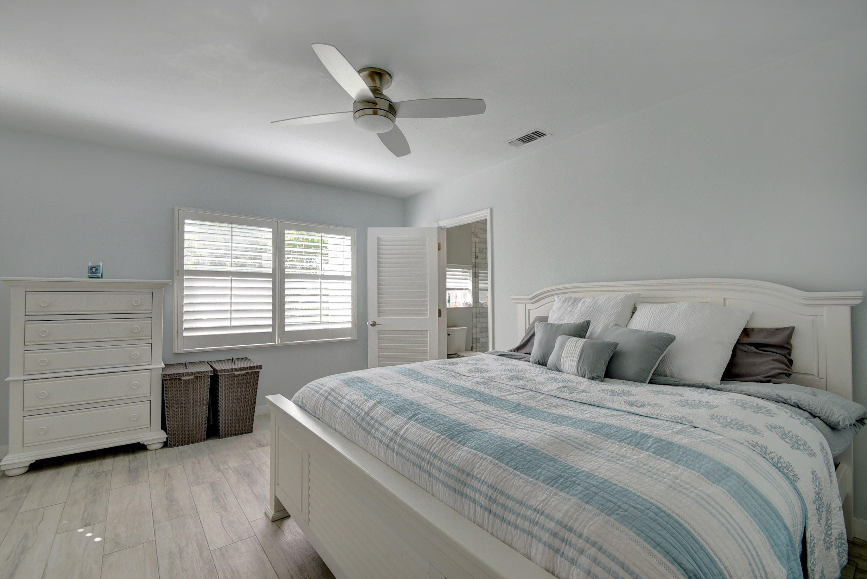 1020 Casuarina Road Delray Beach, FL 33483 - Photo 7 of 17 a bedroom with a bed and a dresser