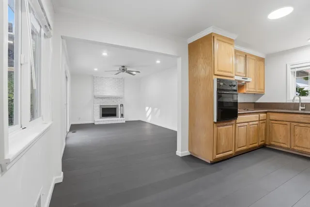 a kitchen with a refrigerator and a sink