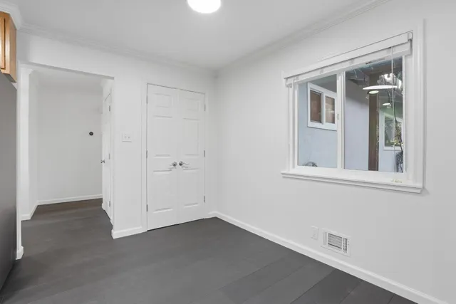 a kitchen with a stove oven and sink
