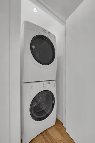 a view of a hallway with washer and dryer