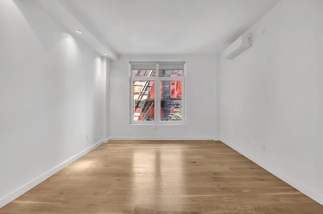 a view of an empty room and window