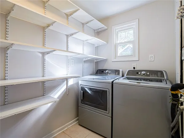 a view of washer and dryer with kitchen countertops
