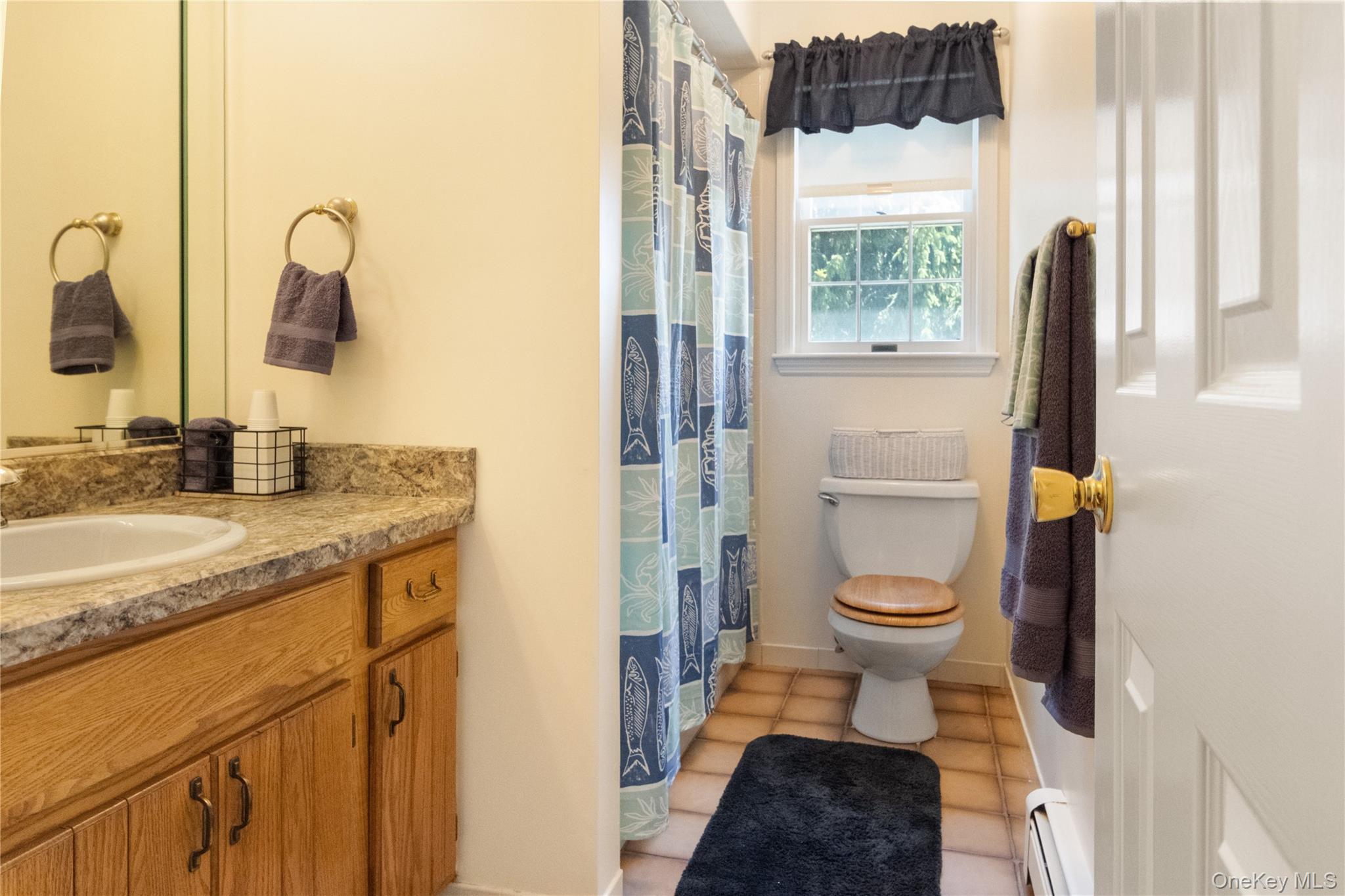 214 West Mombasha Road Monroe, NY 10950 - Photo 31 of 43 a bathroom with a granite countertop toilet sink and a mirror