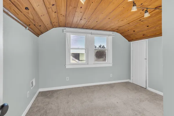 a view of a room with a large window