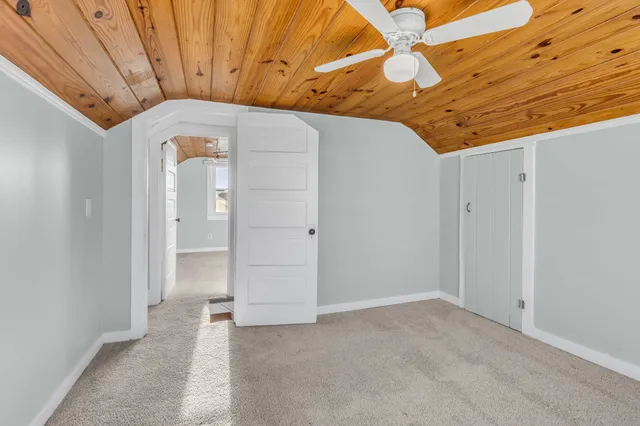 a view of a hallway with a chandelier