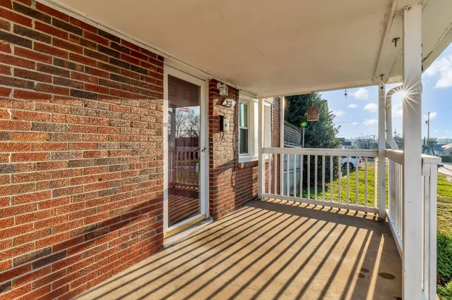 a view of a balcony with wooden floor