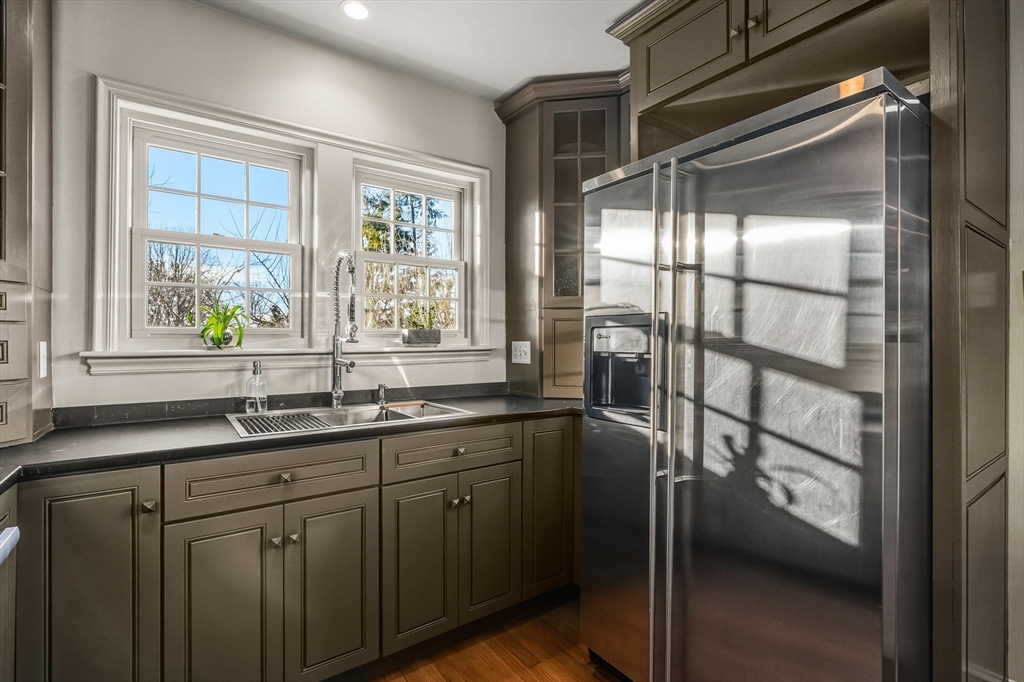96 Gardner Road, Unit 96 Brookline, MA 02445 - Photo 12 of 42 a kitchen with a sink and large window