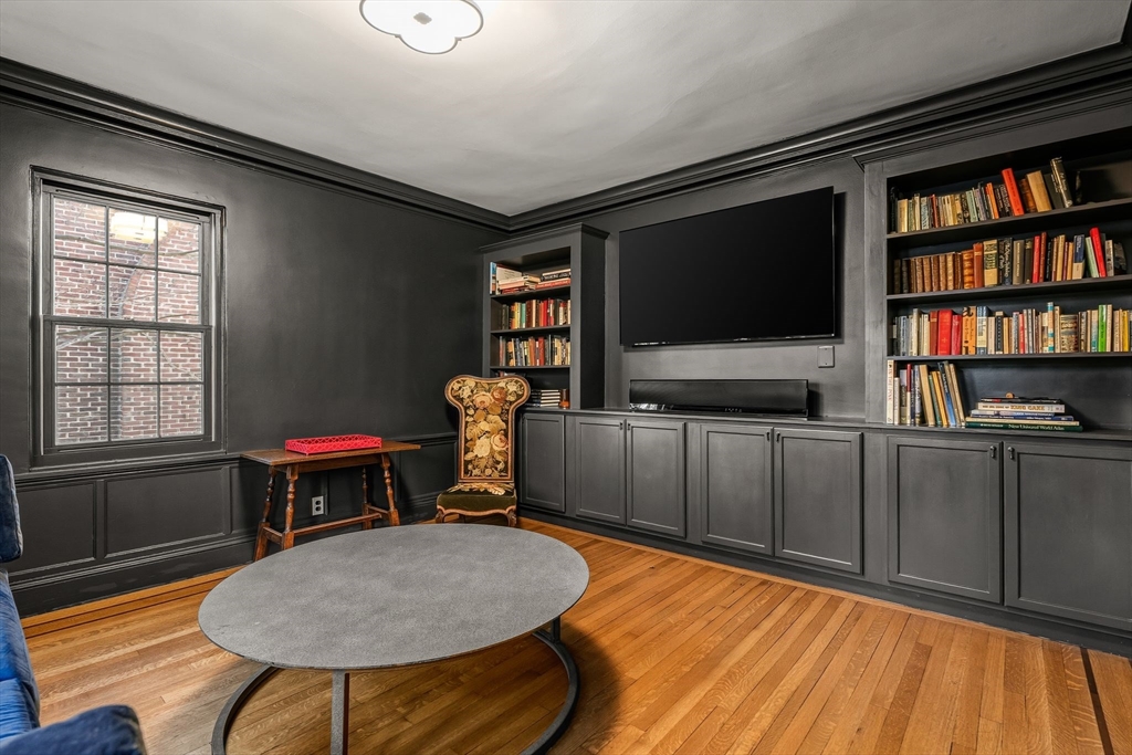 96 Gardner Road, Unit 96 Brookline, MA 02445 - Photo 15 of 42 a room with furniture and a flat screen tv