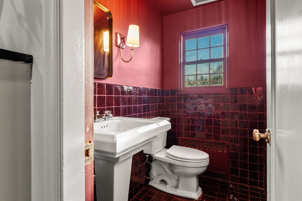 96 Gardner Road, Unit 96 Brookline, MA 02445 - Photo 19 of 42 a bathroom with a toilet sink and mirror