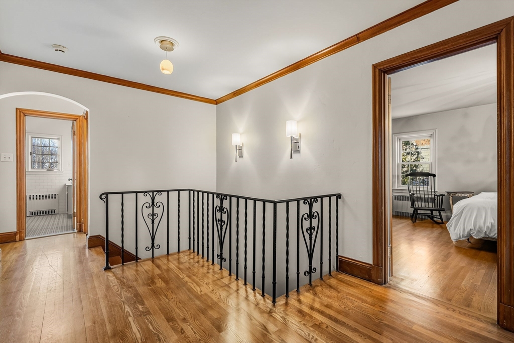96 Gardner Road, Unit 96 Brookline, MA 02445 - Photo 22 of 42 a view of hallway with livingroom and wooden floor