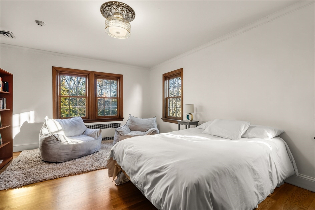 96 Gardner Road, Unit 96 Brookline, MA 02445 - Photo 27 of 42 a spacious bedroom with two beds and a window