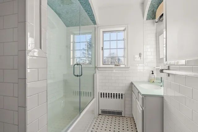 a bathroom with a sink toilet and shower