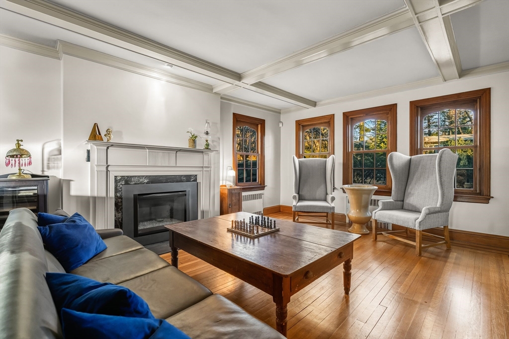 96 Gardner Road, Unit 96 Brookline, MA 02445 - Photo 4 of 42 a living room with furniture and a fireplace