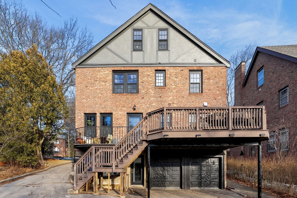 96 Gardner Road, Unit 96 Brookline, MA 02445 - Photo 42 of 42 a view of a house with a wooden deck
