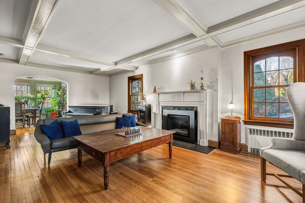 96 Gardner Road, Unit 96 Brookline, MA 02445 - Photo 5 of 42 a living room with furniture and a fireplace