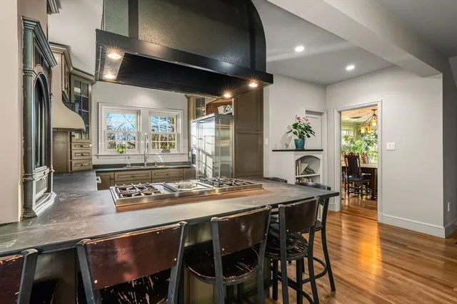 a dining table with chairs and wooden floor
