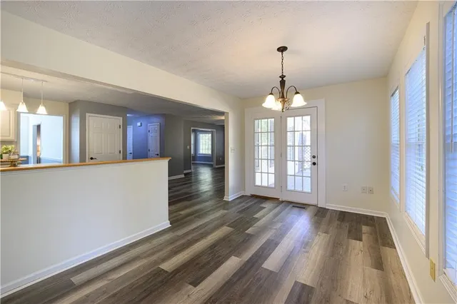 a bathroom with a double vanity sink toilet mirror and shower