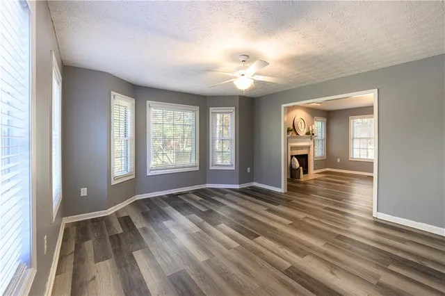 a kitchen with granite countertop a sink cabinets and stainless steel appliances