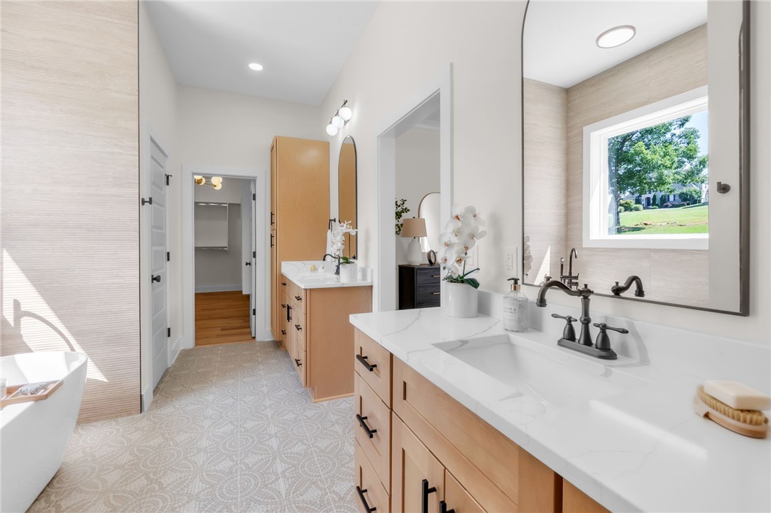 574 Paramount Drive Seneca, SC 29678 - Photo 22 of 45 Dual vanities with pristine white countertops provide ample space in this airy primary bathroom.