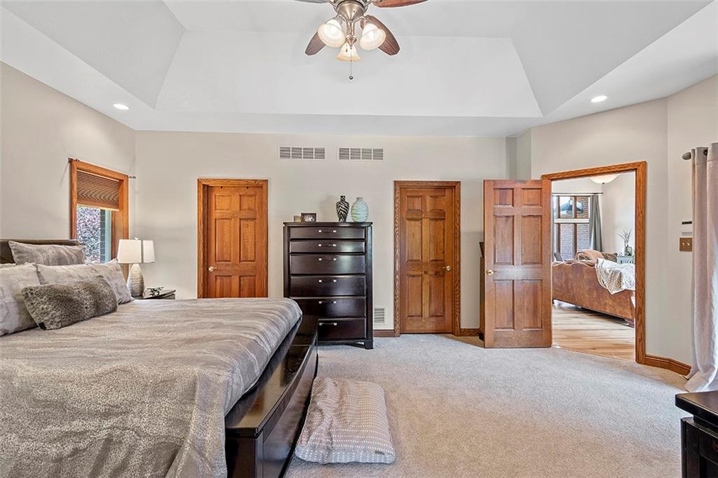 1860 Eastbrook Road New Castle, PA 16101 - Photo 14 of 25 a bedroom with a bed and a chandelier