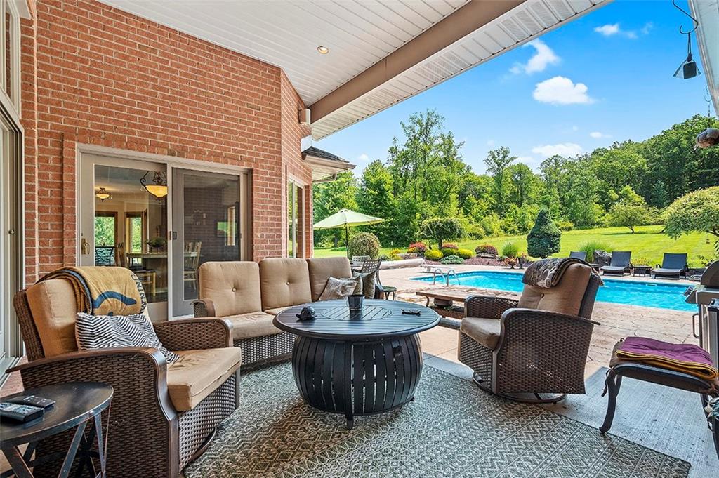 1860 Eastbrook Road New Castle, PA 16101 - Photo 6 of 25 a living room with patio furniture and a potted plant