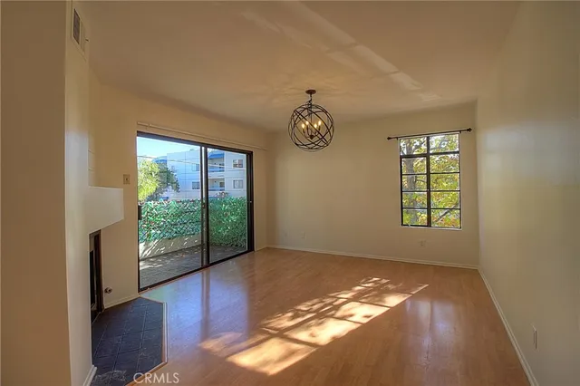 a view of livingroom with furniture wooden floor and front door