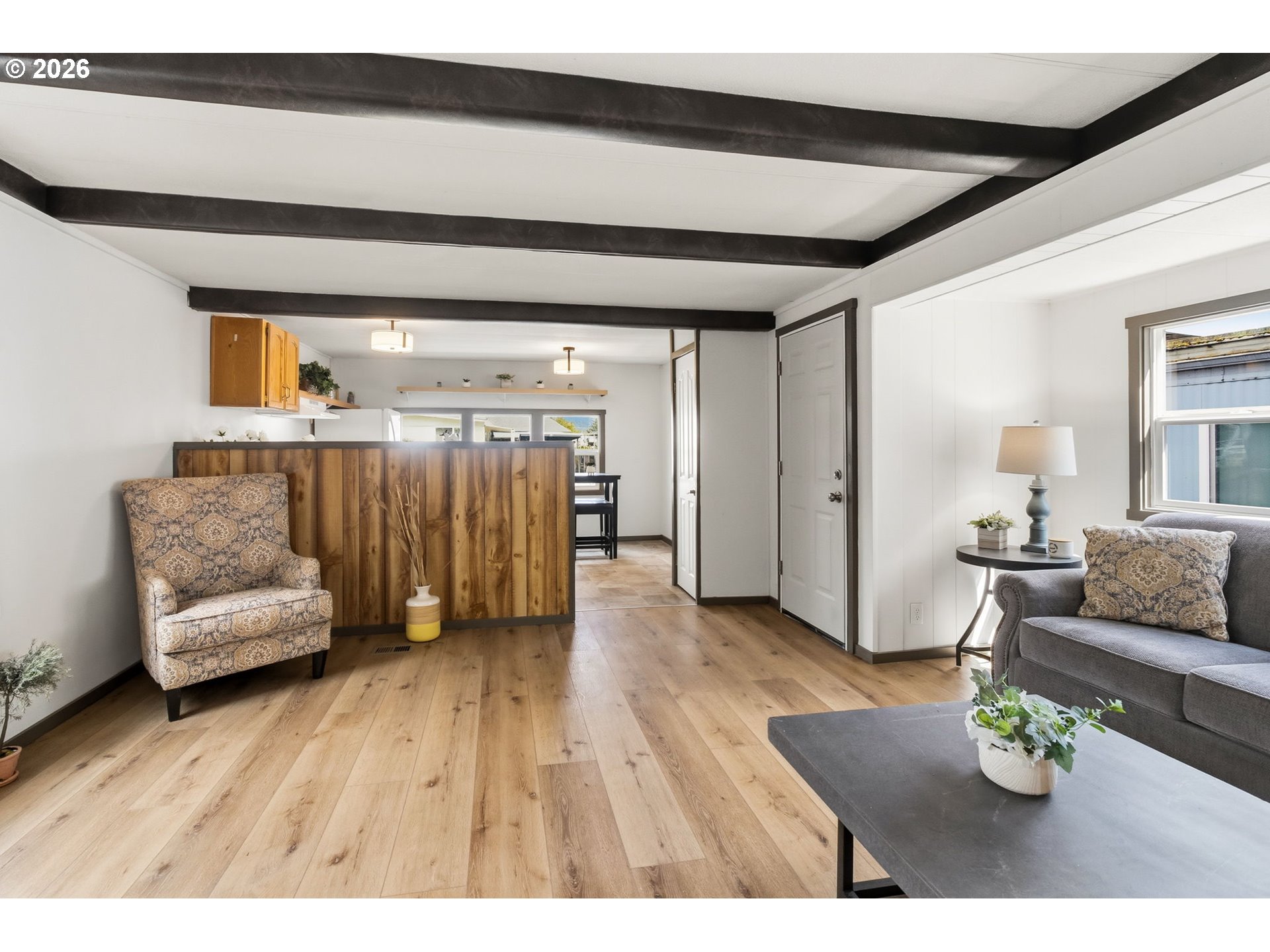 205 South 54th Street, Unit 76 Springfield, OR 97478 - Photo 11 of 41 a living room with furniture and wooden floor