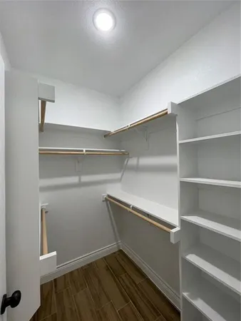 a view of an empty walk in closet