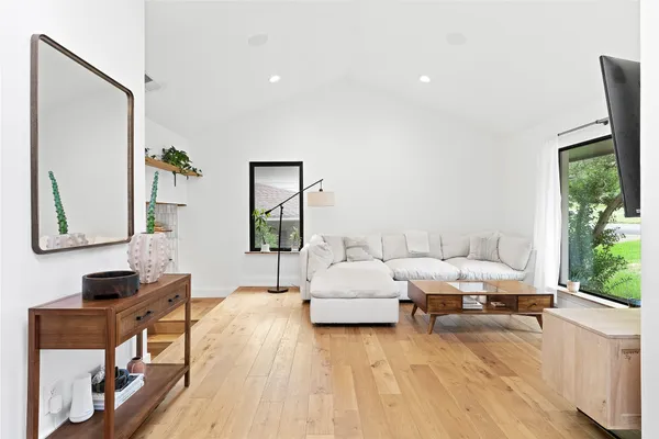 a living room with furniture and a large window