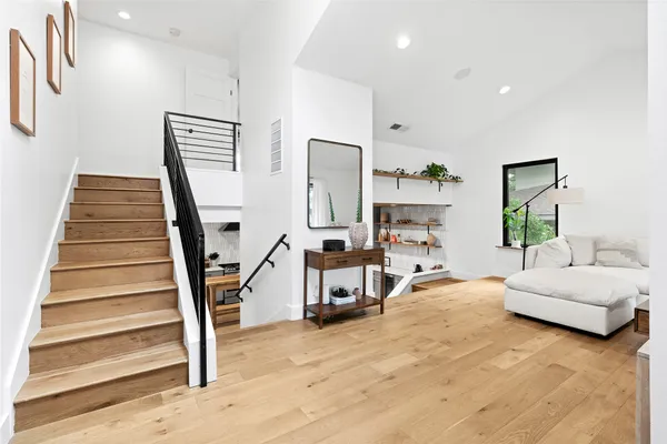 a kitchen with stainless steel appliances a sink a stove and a refrigerator