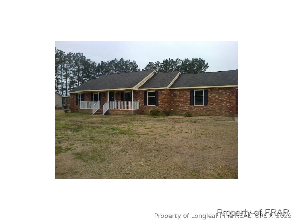 2121 Bainbridge Road Stedman, NC 28391 - Photo 1 of 16 a view of a house with a backyard